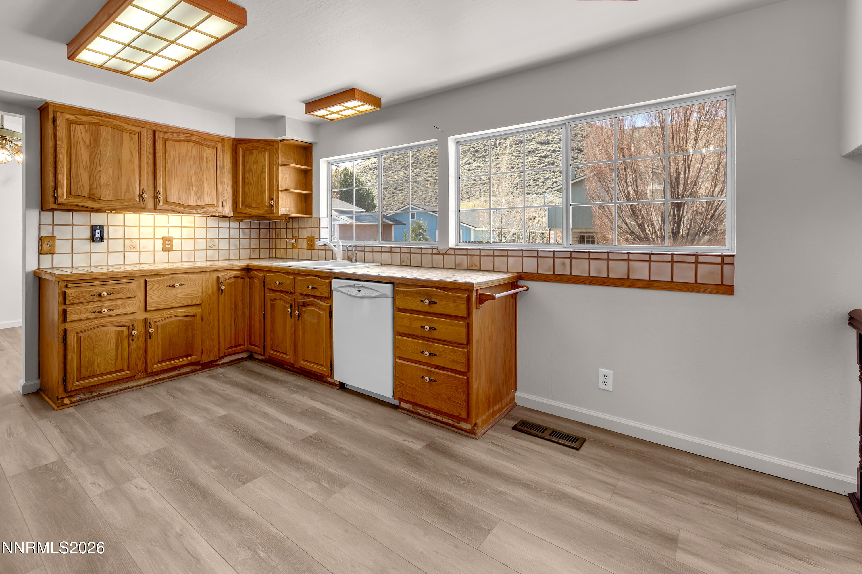 4505 Gorc Way Reno, NV 89502 - Photo 12 of 48 a kitchen with stainless steel appliances granite countertop a stove and cabinets