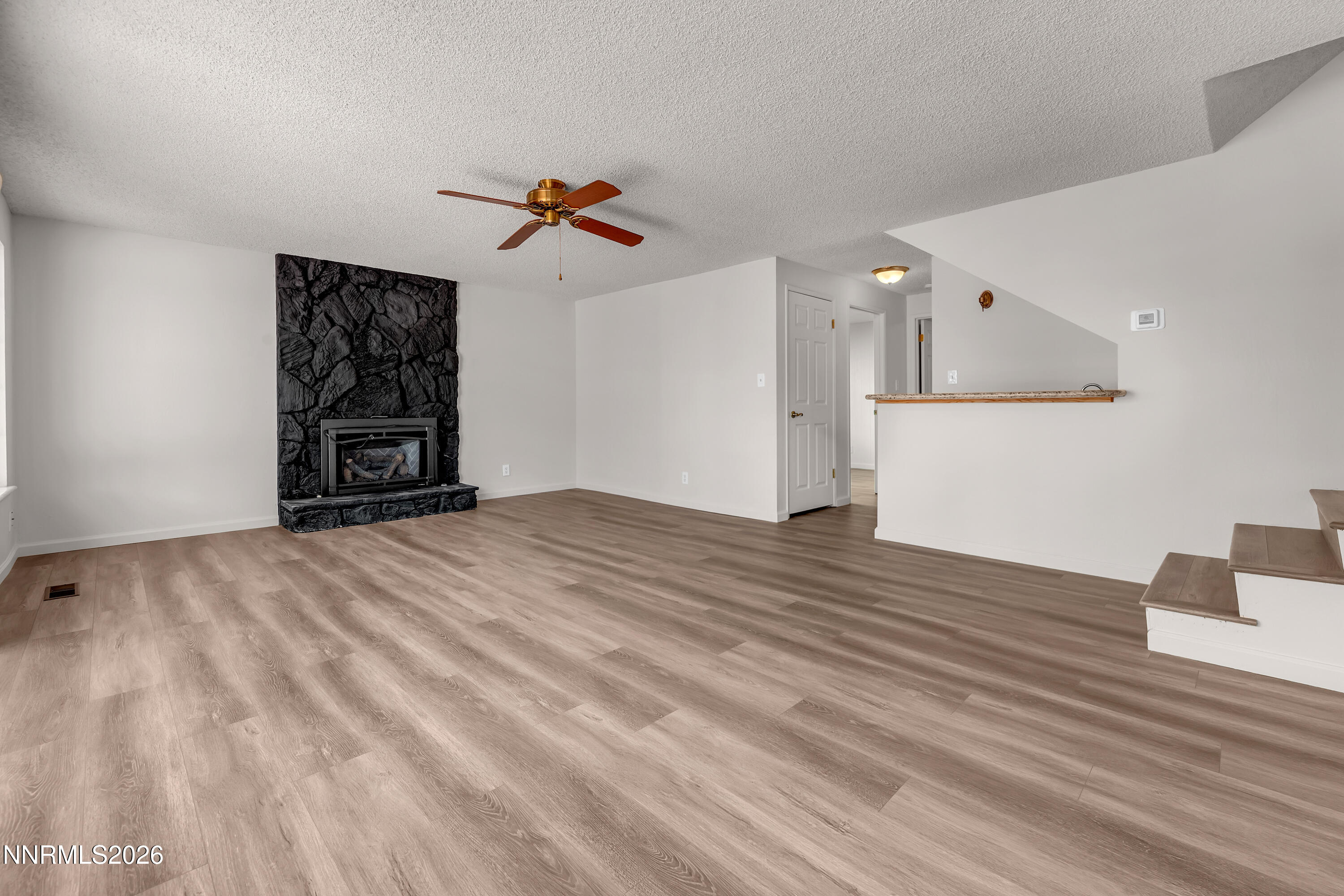 4505 Gorc Way Reno, NV 89502 - Photo 17 of 48 a view of empty room with wooden floor