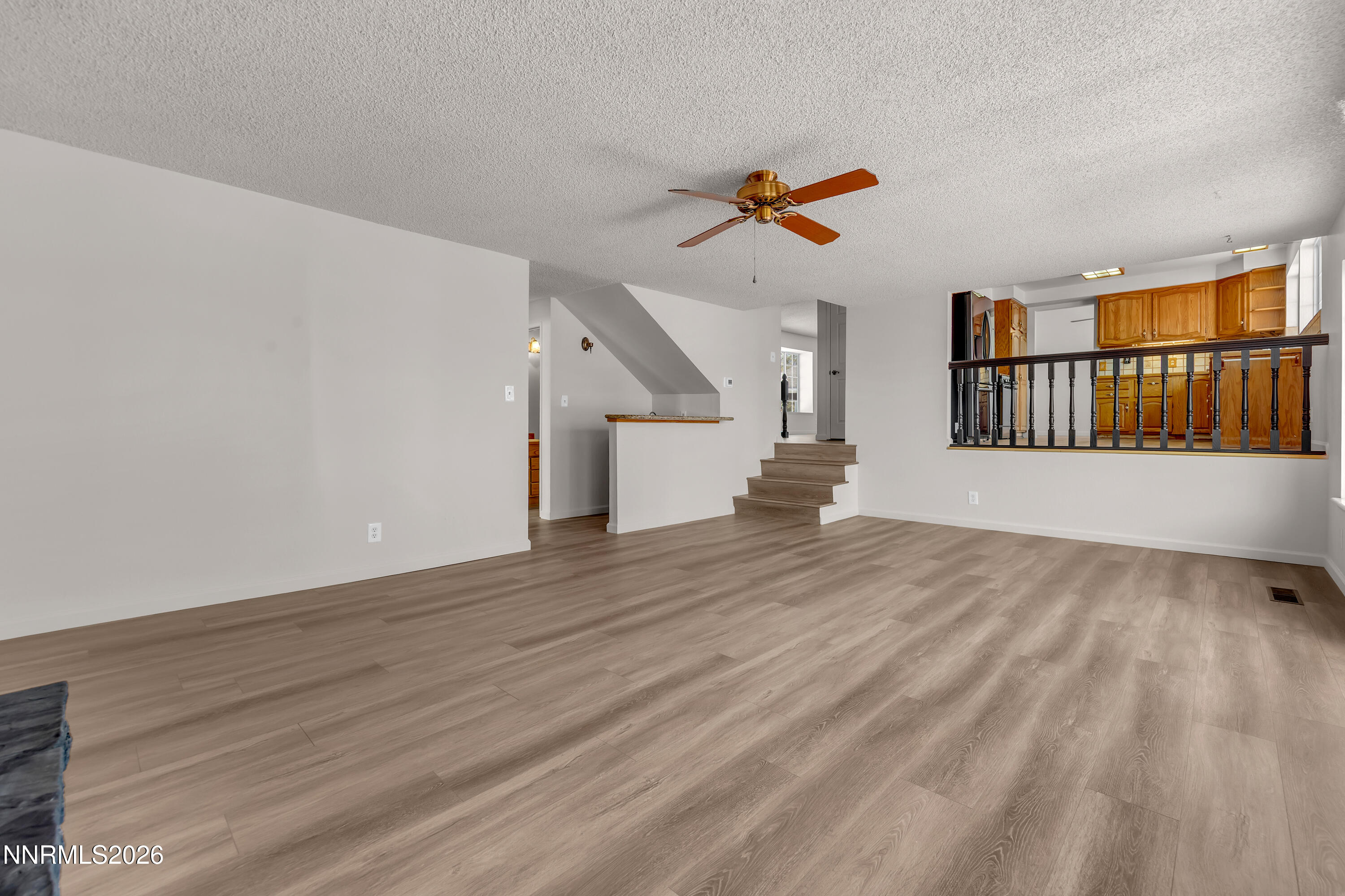 4505 Gorc Way Reno, NV 89502 - Photo 18 of 48 a view of empty room with wooden floor and fan