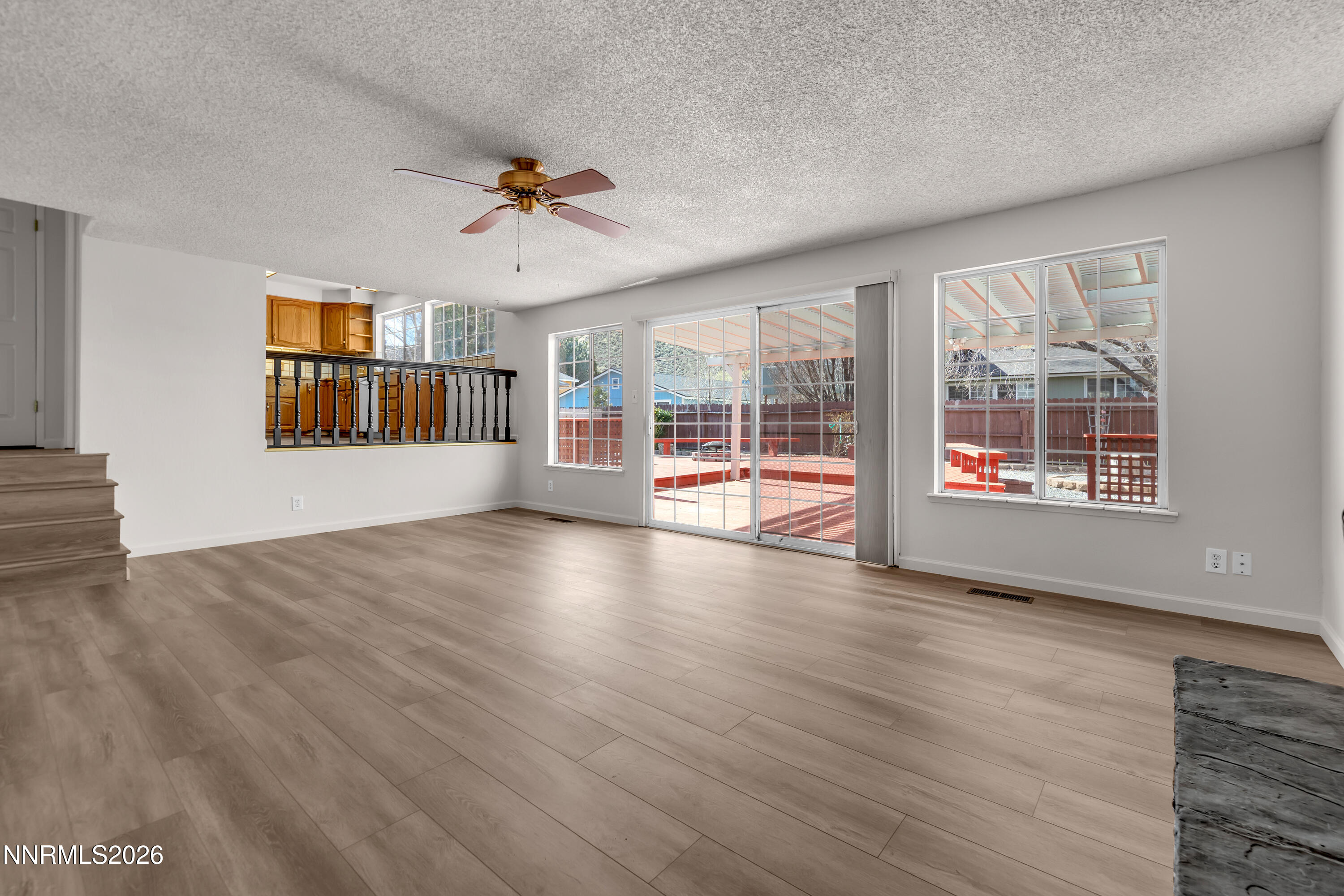 4505 Gorc Way Reno, NV 89502 - Photo 19 of 48 an empty room with wooden floor and windows