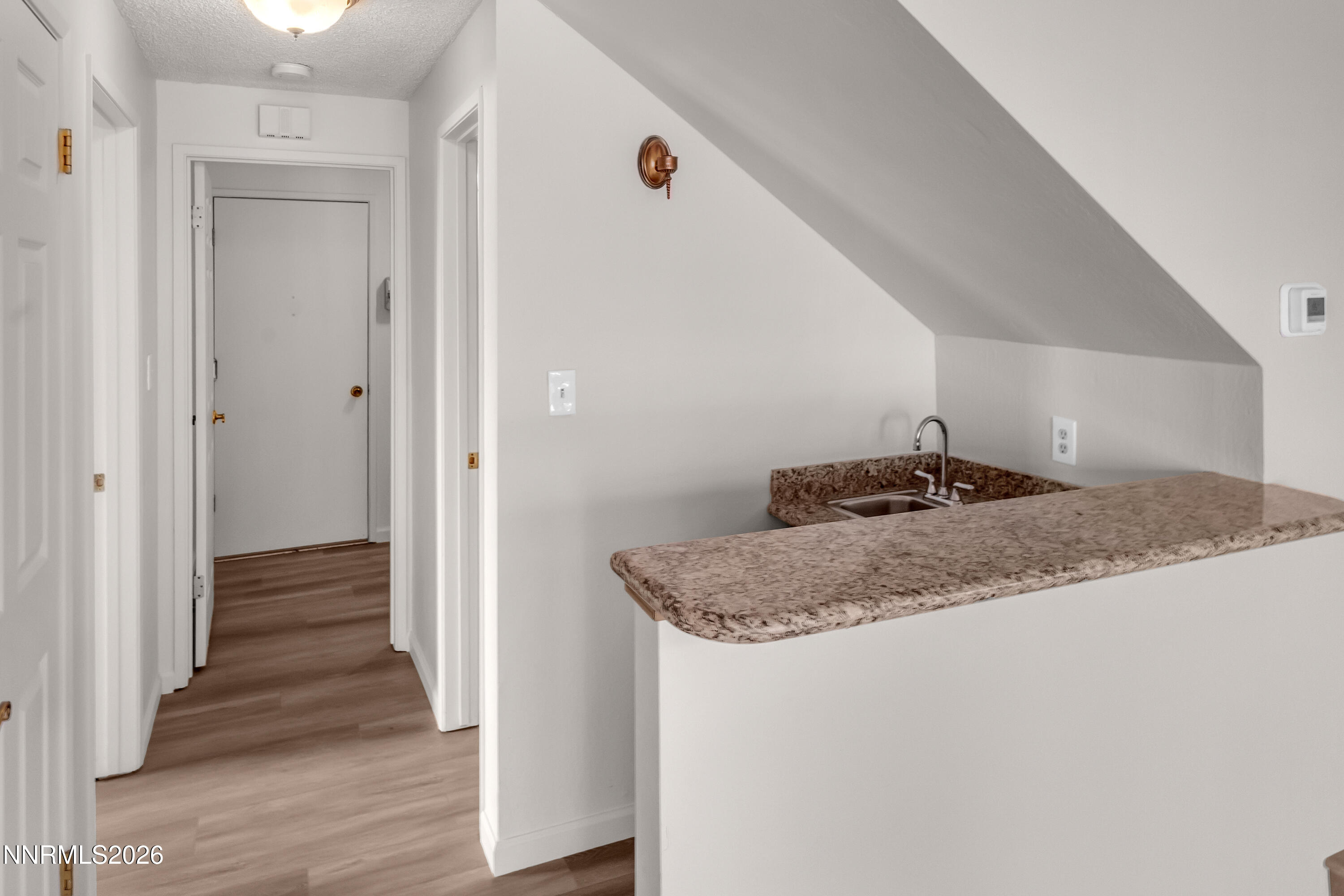 4505 Gorc Way Reno, NV 89502 - Photo 21 of 48 a bathroom with a granite countertop sink and a mirror