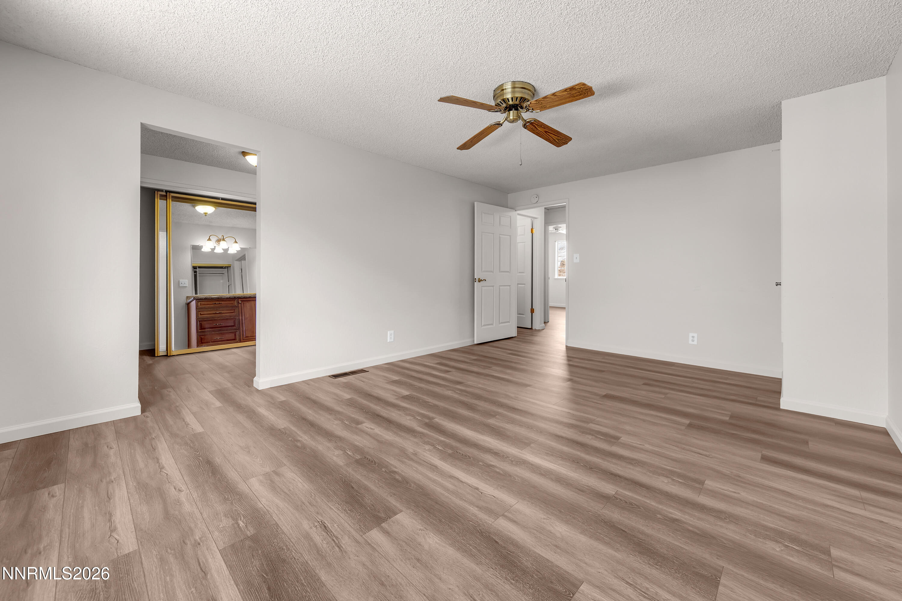 4505 Gorc Way Reno, NV 89502 - Photo 26 of 48 a view of empty room with wooden floor and ceiling fan