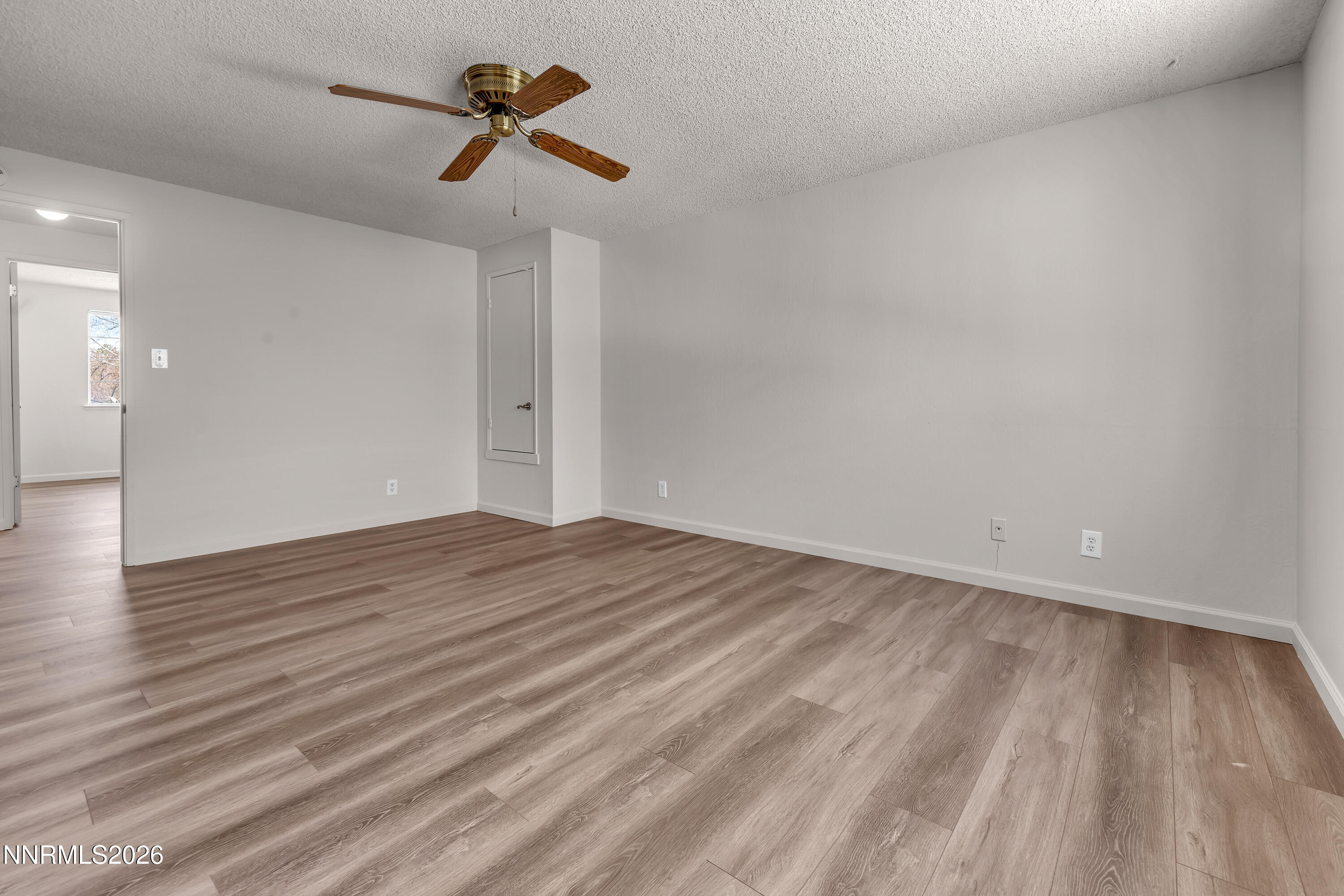 4505 Gorc Way Reno, NV 89502 - Photo 27 of 48 a view of empty room with wooden floor and fan