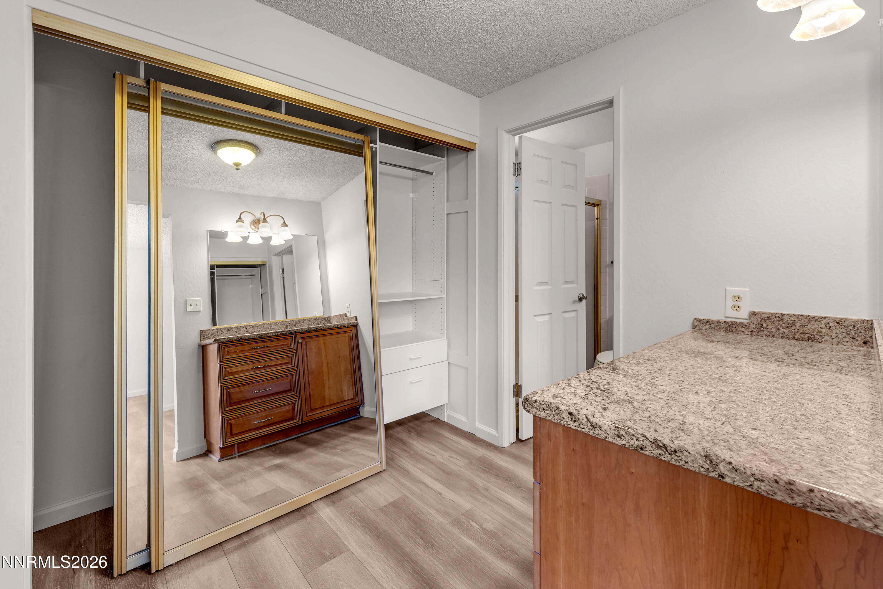 4505 Gorc Way Reno, NV 89502 - Photo 28 of 48 a bathroom with a granite countertop sink and a mirror