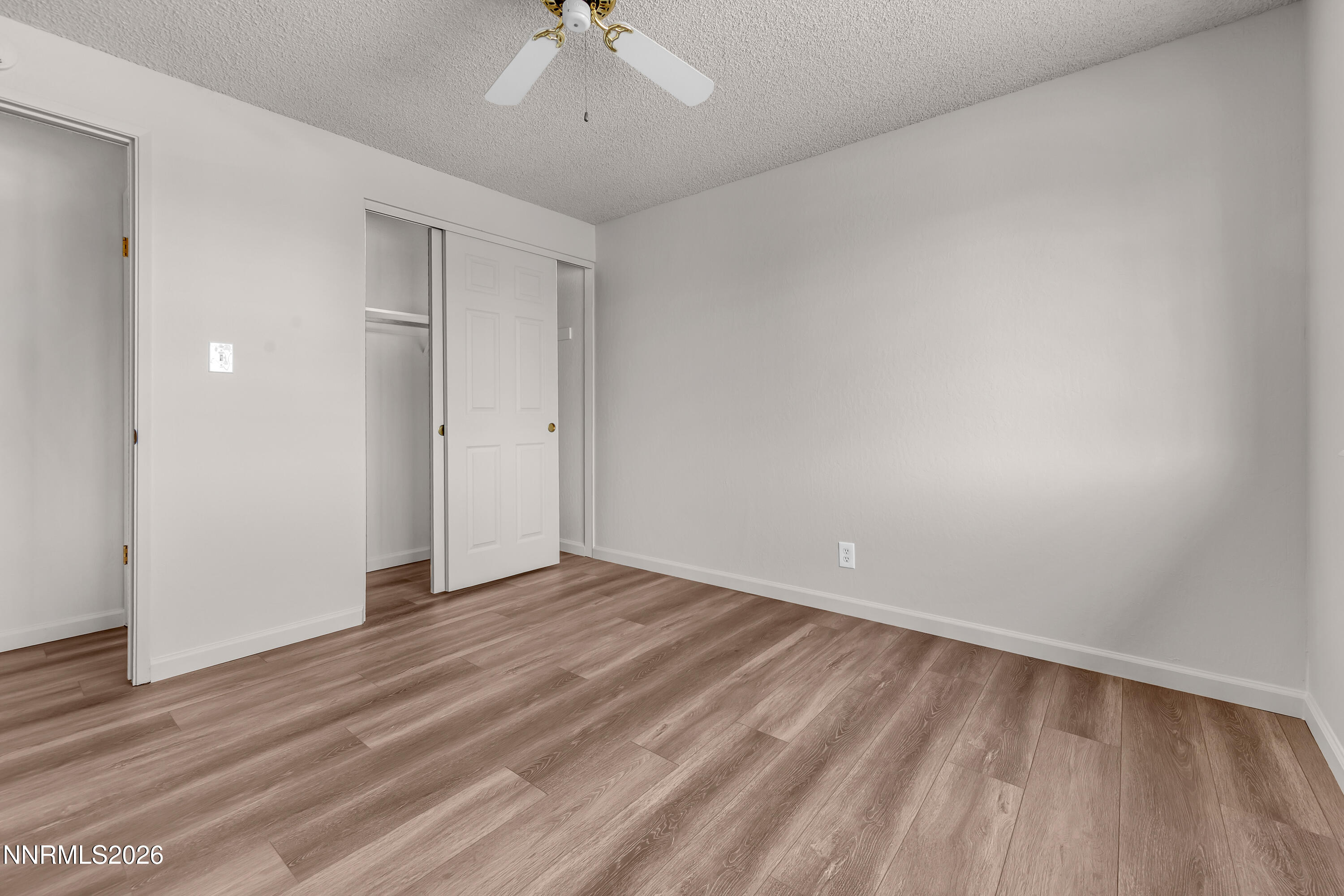 4505 Gorc Way Reno, NV 89502 - Photo 33 of 48 a view of an empty room with wooden floor