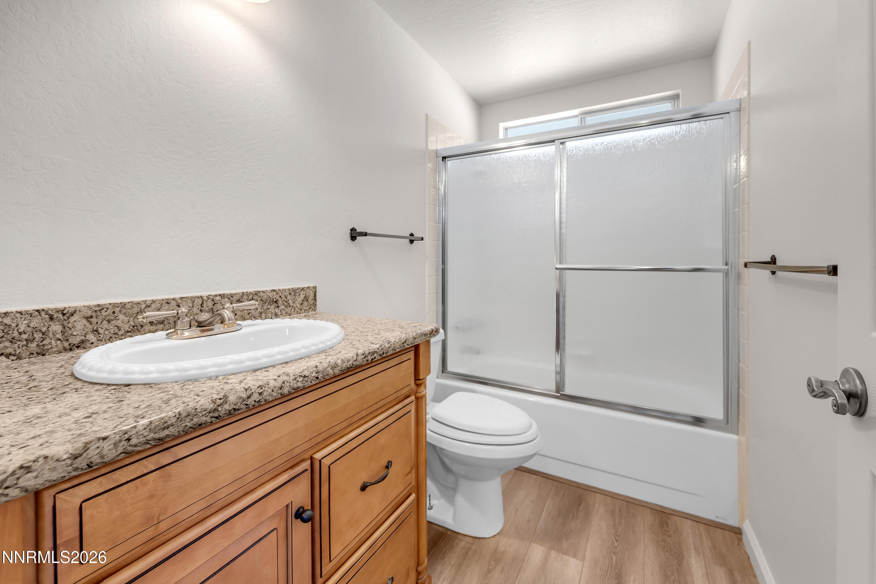 4505 Gorc Way Reno, NV 89502 - Photo 37 of 48 a bathroom with a granite countertop sink mirror vanity and toilet