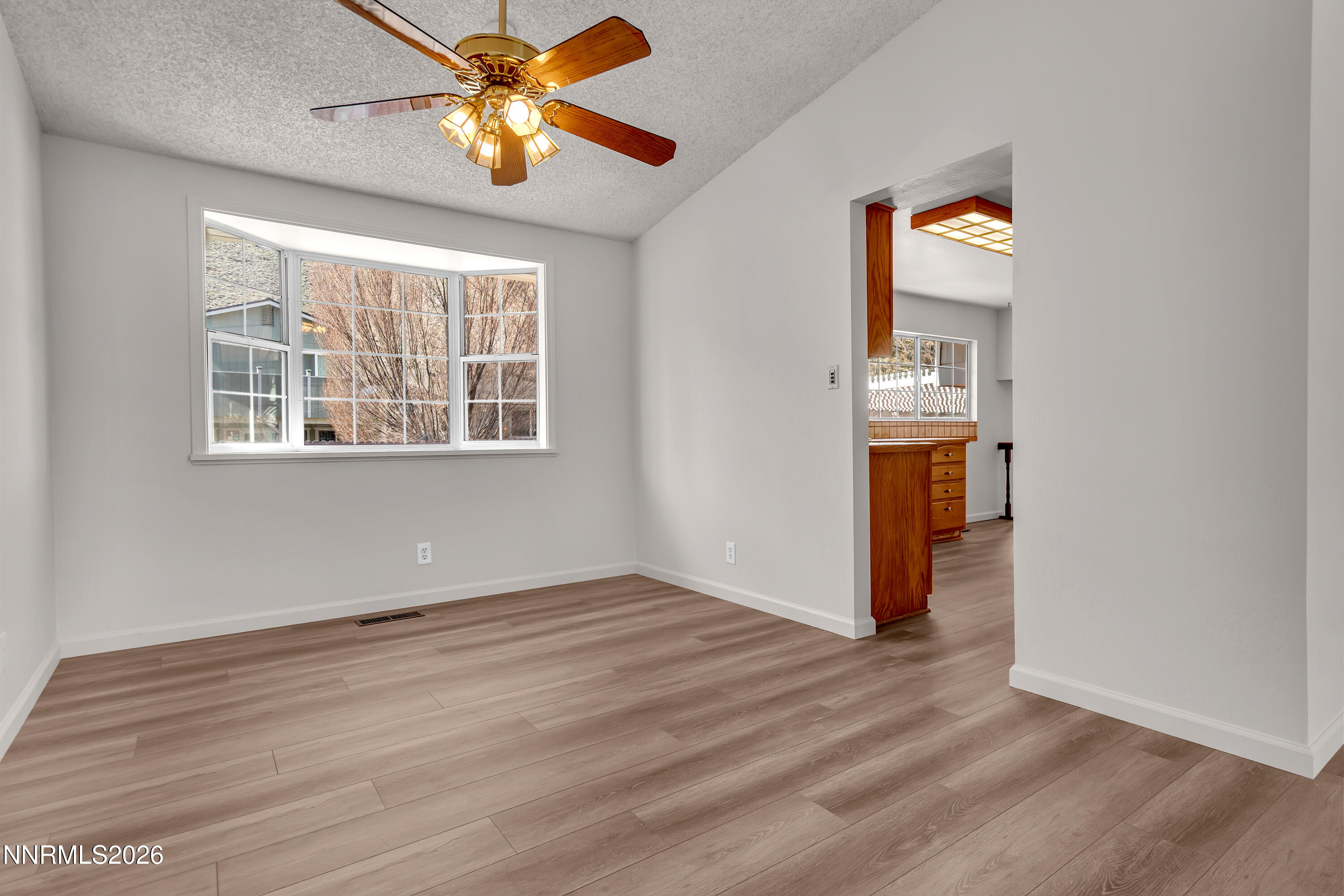 4505 Gorc Way Reno, NV 89502 - Photo 8 of 48 an empty room with wooden floor closet and windows