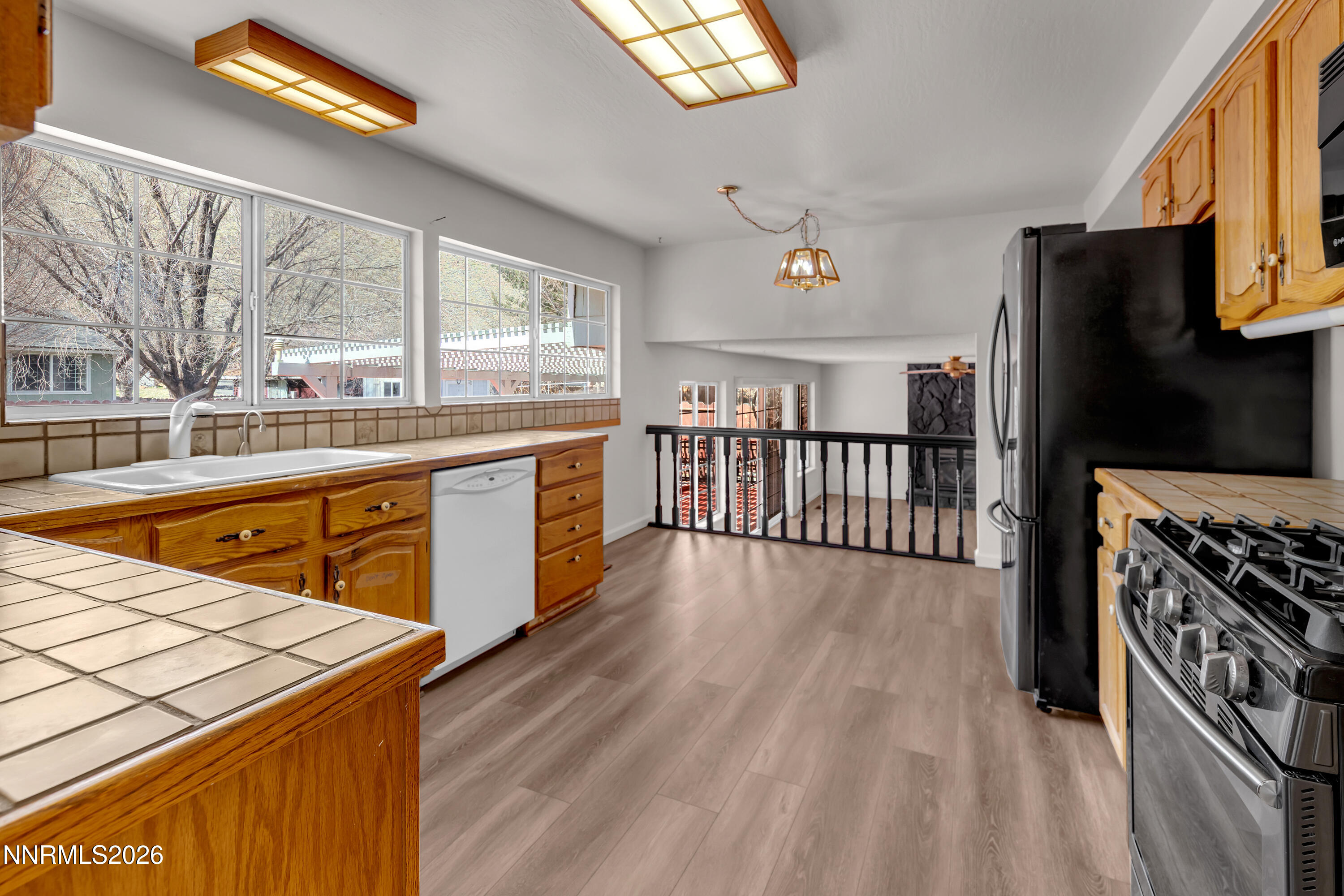 4505 Gorc Way Reno, NV 89502 - Photo 10 of 48 a open kitchen with stainless steel appliances granite countertop a stove and a refrigerator