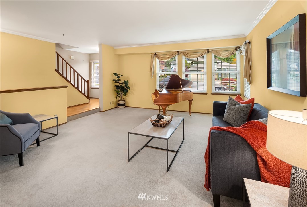 210 237th Place Southwest Bothell, WA 98021 - Photo 2 of 23 a living room with furniture and a floor to ceiling window