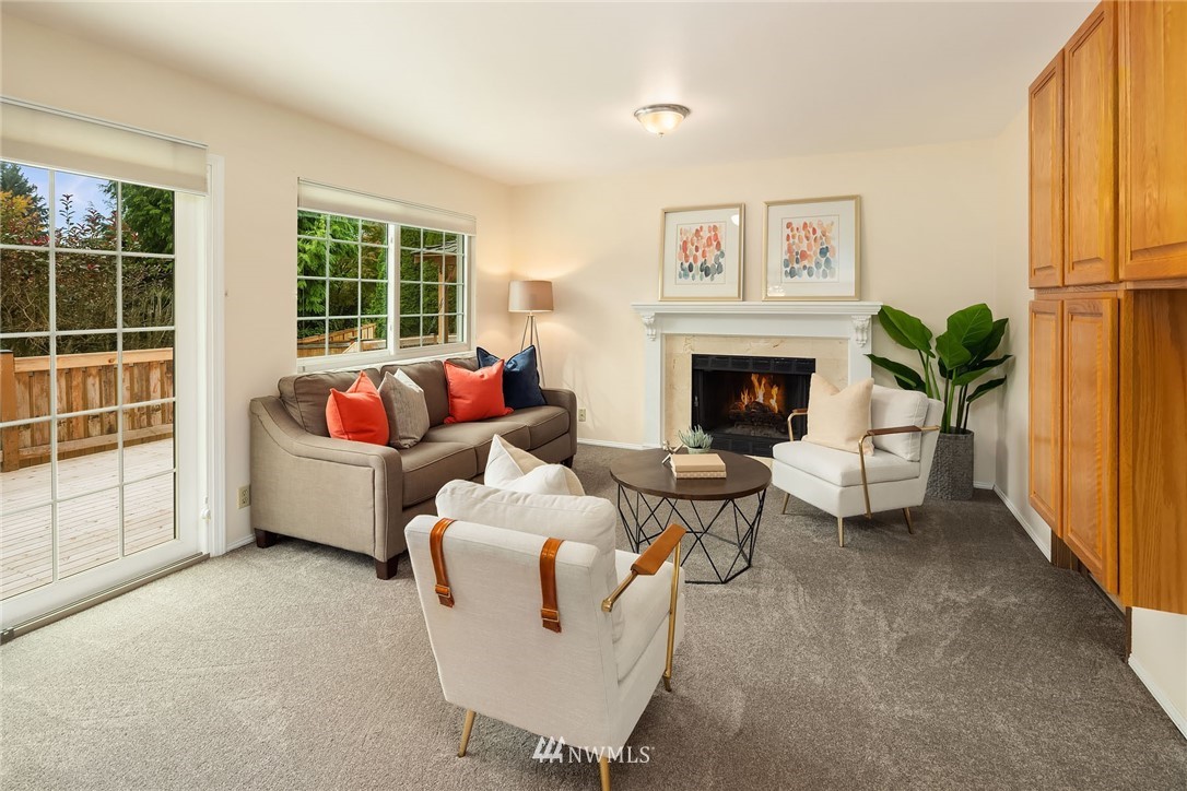210 237th Place Southwest Bothell, WA 98021 - Photo 11 of 23 a living room with furniture and a fireplace