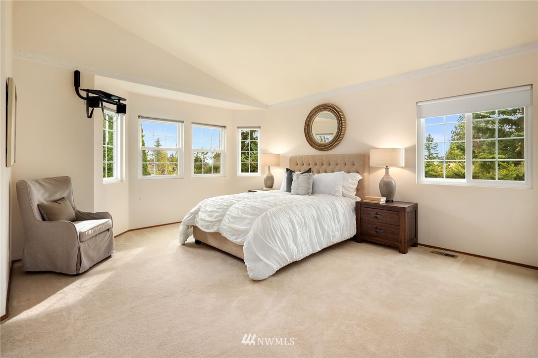 210 237th Place Southwest Bothell, WA 98021 - Photo 12 of 23 a bedroom with a bed and a large window