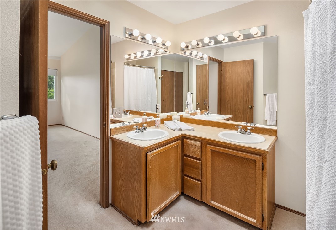 210 237th Place Southwest Bothell, WA 98021 - Photo 14 of 23 a bathroom with a sink and a mirror