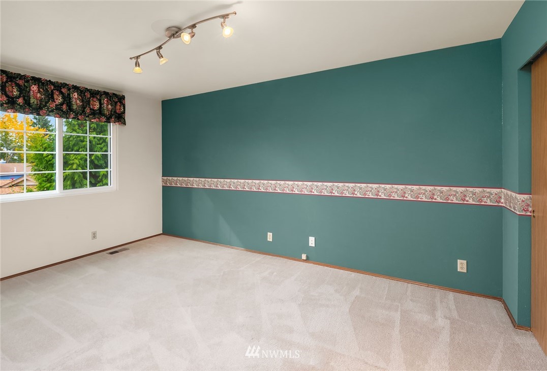 210 237th Place Southwest Bothell, WA 98021 - Photo 16 of 23 a view of a livingroom with an empty space and a window