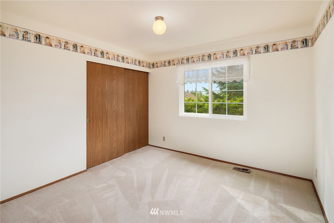 210 237th Place Southwest Bothell, WA 98021 - Photo 18 of 23 a view of an empty room with a window