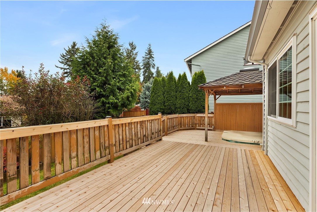 210 237th Place Southwest Bothell, WA 98021 - Photo 19 of 23 a view of balcony with wooden floor and fence