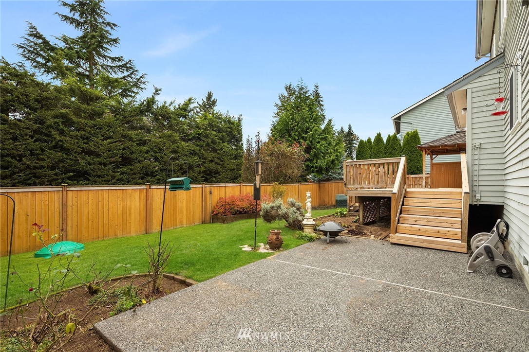 210 237th Place Southwest Bothell, WA 98021 - Photo 22 of 23 a view of backyard with parked car