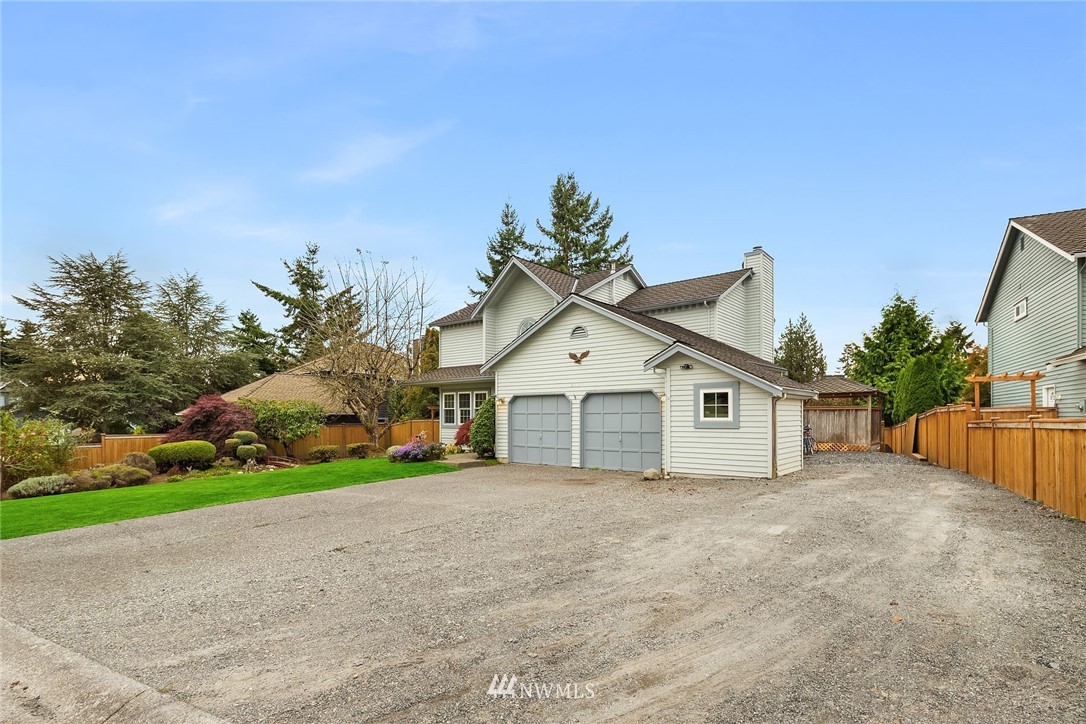 210 237th Place Southwest Bothell, WA 98021 - Photo 23 of 23 a view of a house with a yard and potted plants