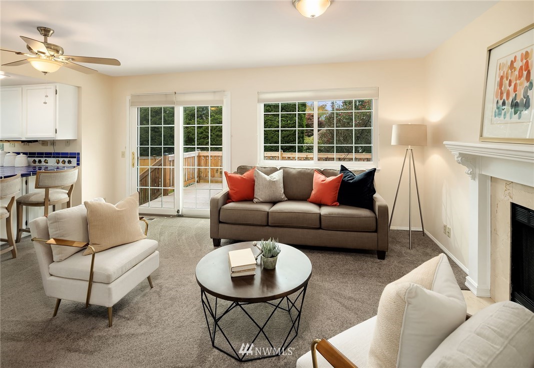 210 237th Place Southwest Bothell, WA 98021 - Photo 9 of 23 a living room with furniture and a large window