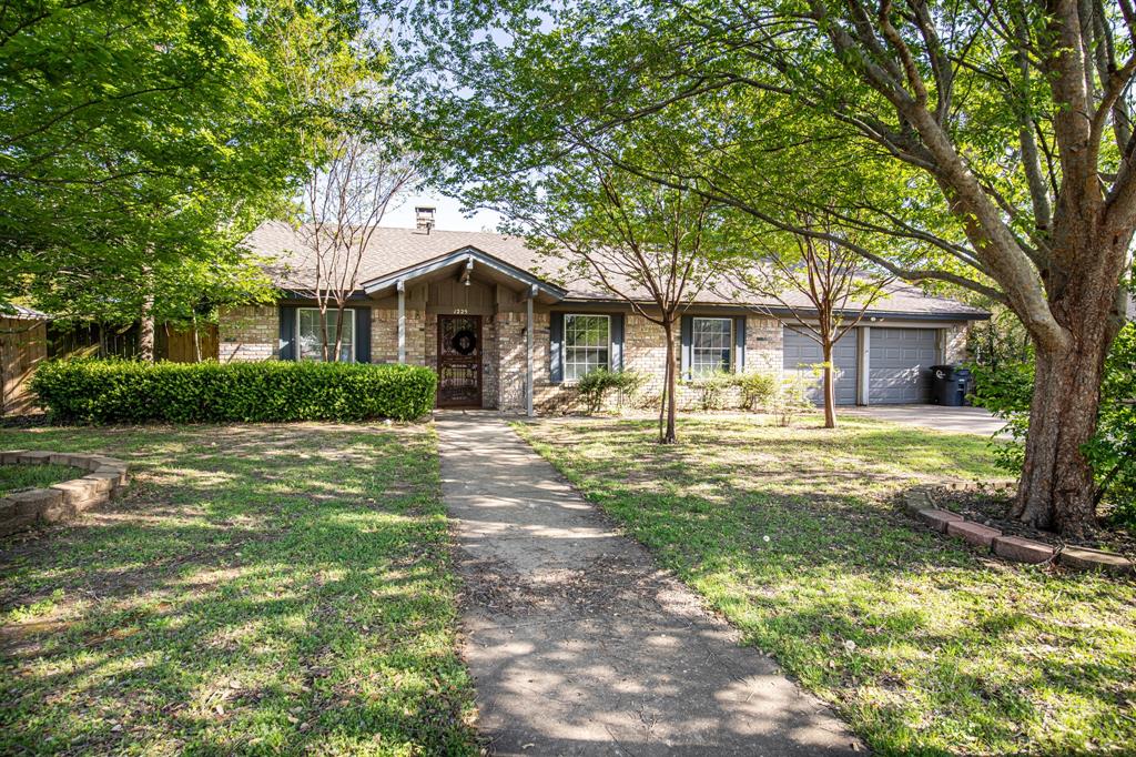 1225 Crestwood Drive Cleburne, TX 76033 - Photo 1 of 1 a front view of a house with garden