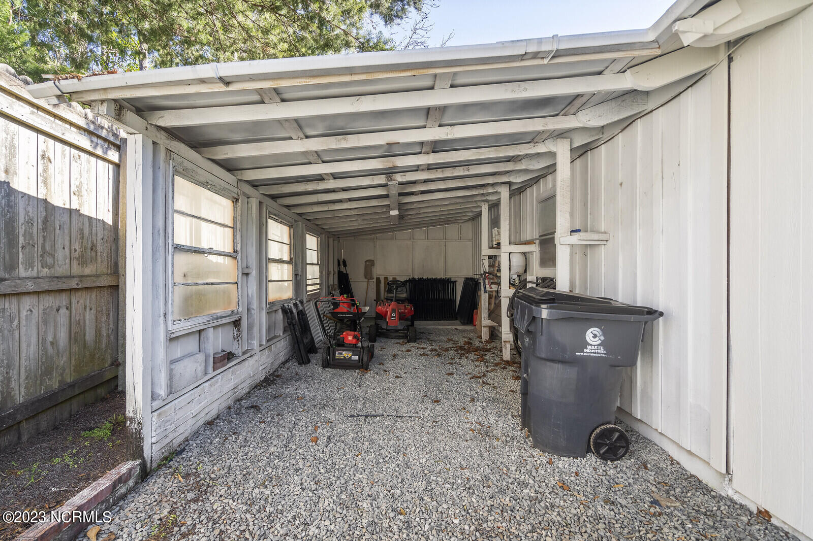 617 Porters Neck Road Wilmington, NC 28411 - Photo 43 of 47 additional covered storage on side of garage