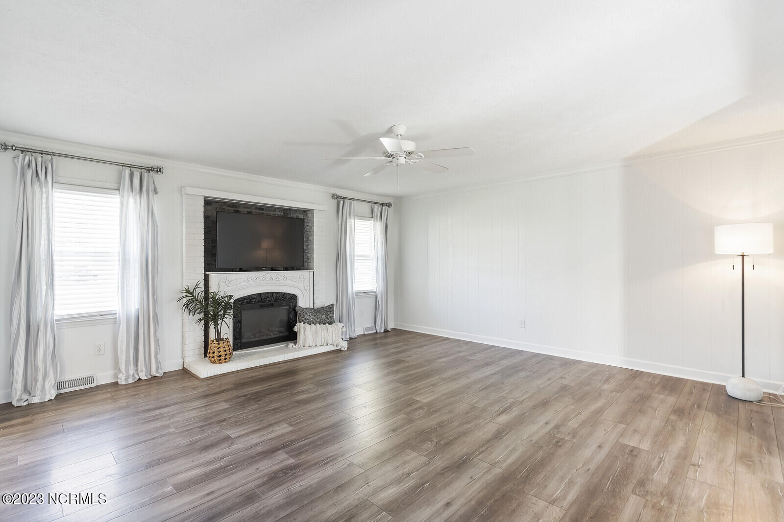 617 Porters Neck Road Wilmington, NC 28411 - Photo 7 of 47 Lots of wonderful natural light filters in all parts of this home. Gorgeous hardwood trees filter the summer sun with big canopies!