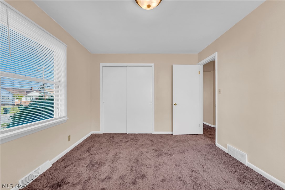 9716 Alexander Road Cleveland, OH 44125 - Photo 11 of 30 Unfurnished bedroom with a closet and carpet
