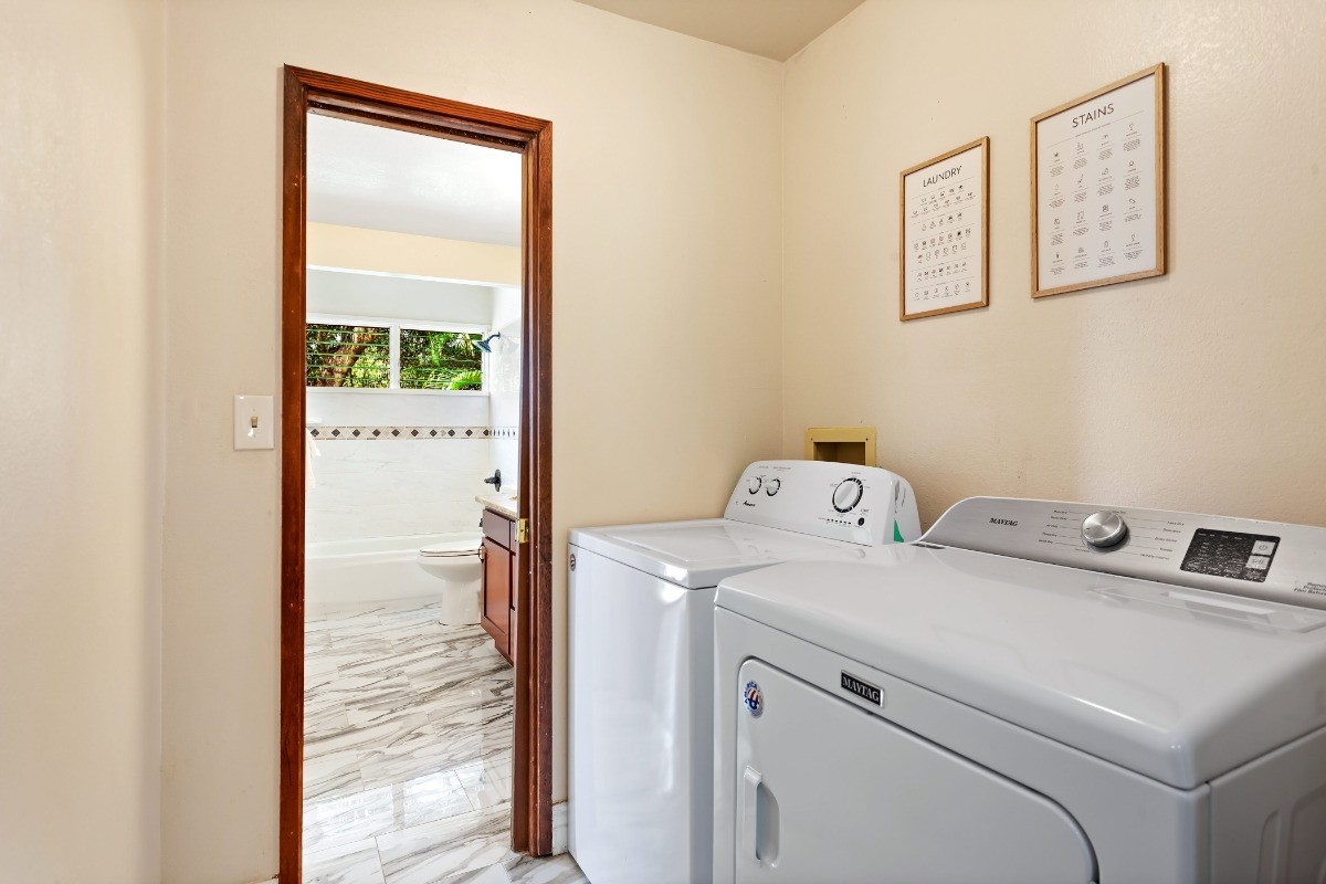 4701 Kawaihau Road, Unit L102 Kapaa, HI 96746 - Photo 14 of 22 a utility room with dryer and washer