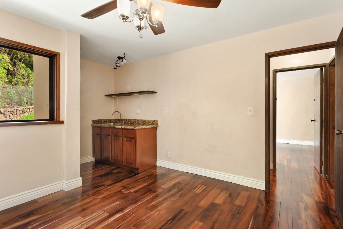 4701 Kawaihau Road, Unit L102 Kapaa, HI 96746 - Photo 16 of 22 wooden floor in an empty room with a window