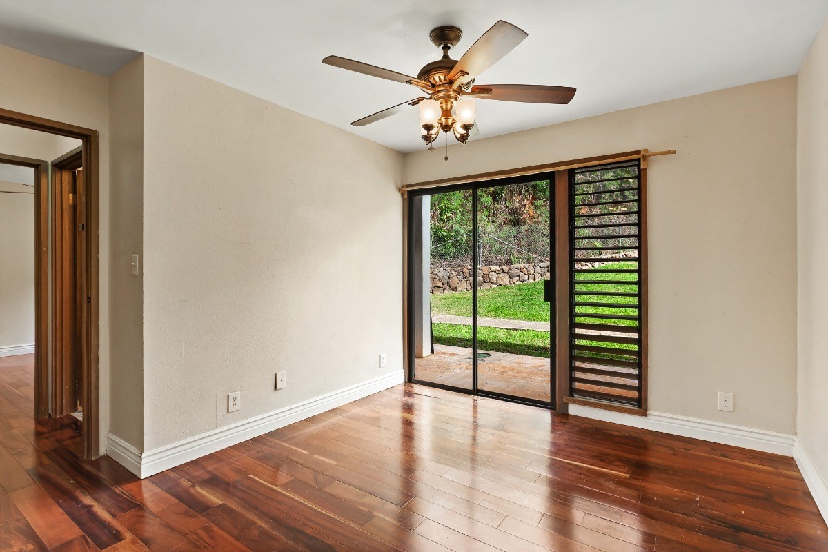 4701 Kawaihau Road, Unit L102 Kapaa, HI 96746 - Photo 18 of 22 a view of an empty room with wooden floor and a window