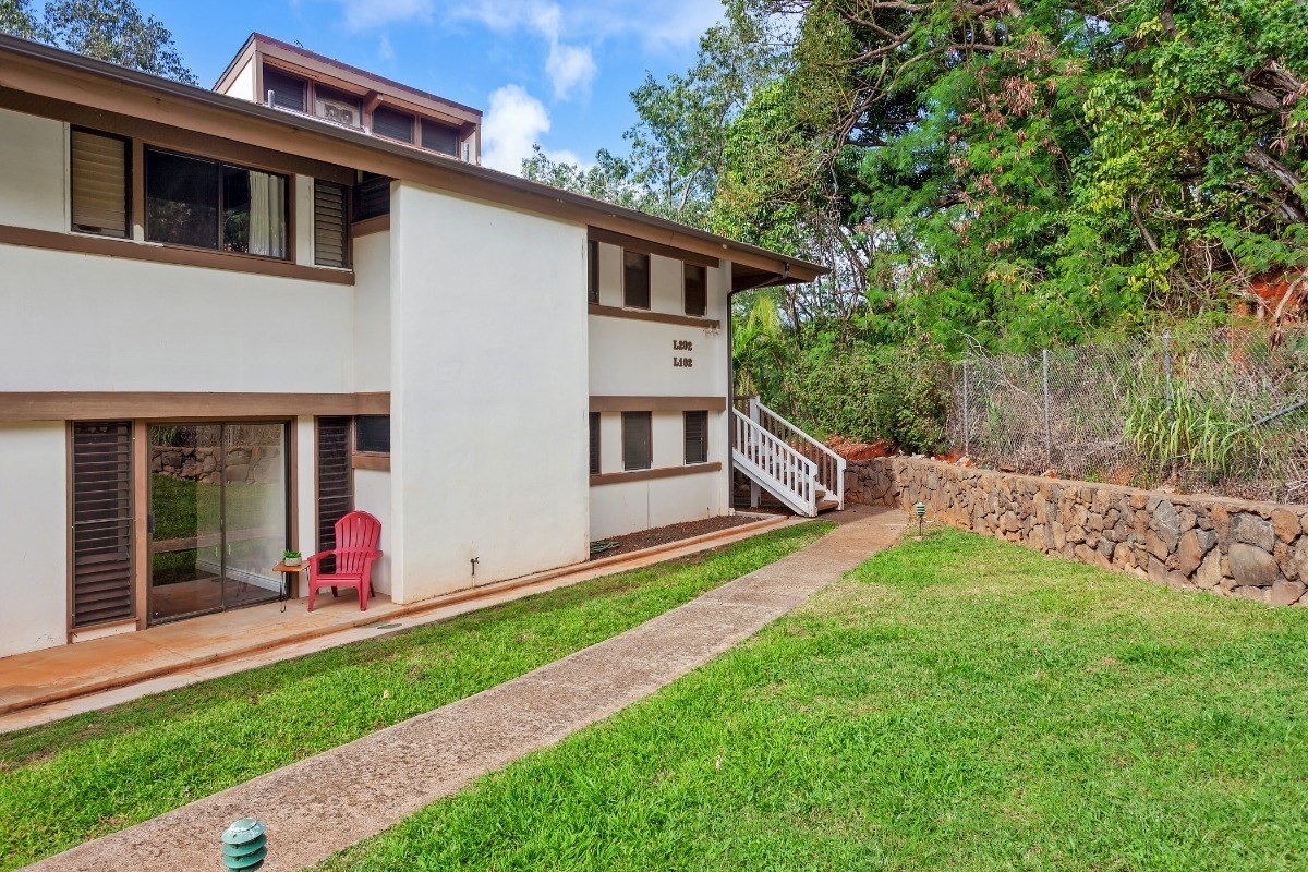 4701 Kawaihau Road, Unit L102 Kapaa, HI 96746 - Photo 20 of 22 a view of an house with backyard space and garden