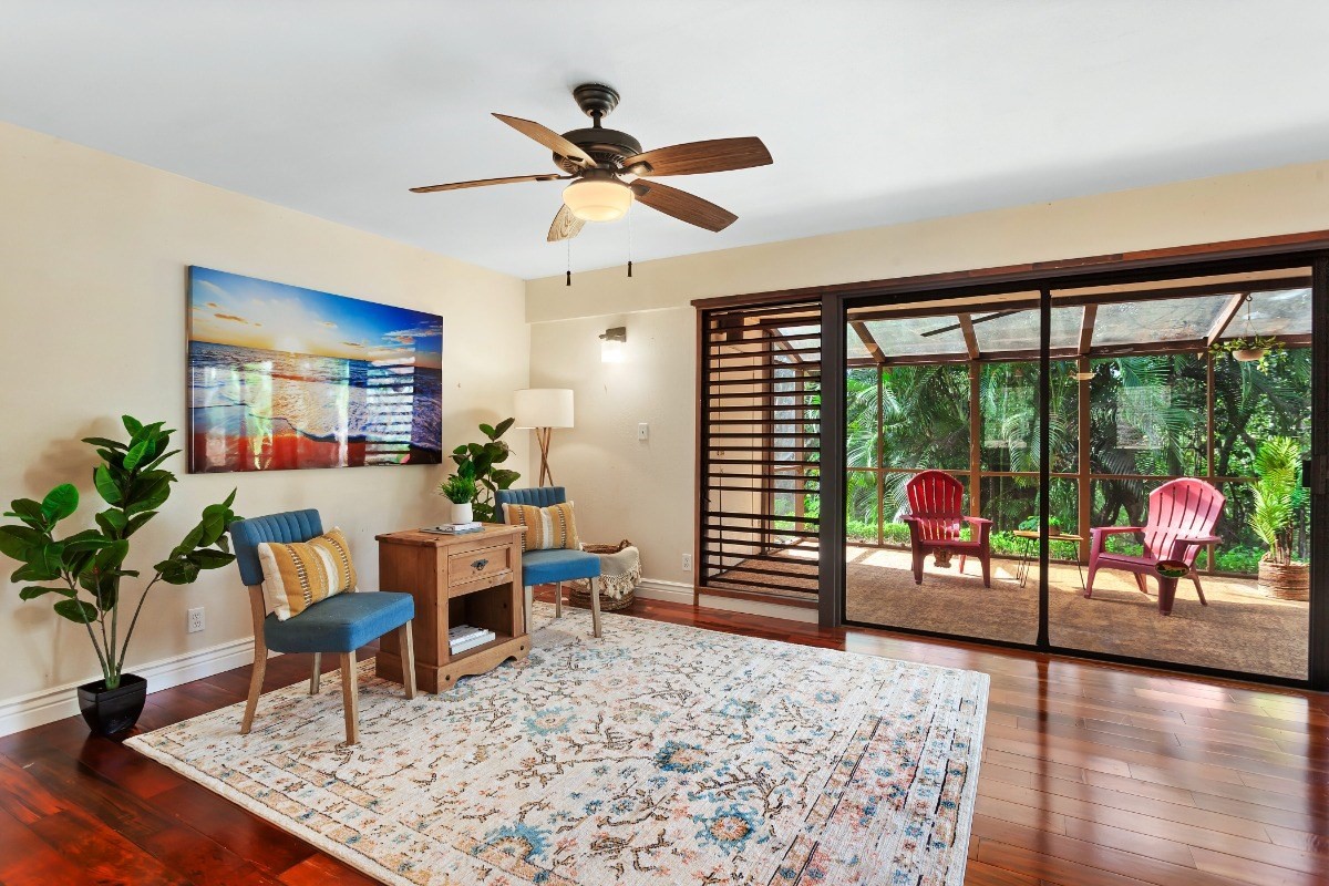 4701 Kawaihau Road, Unit L102 Kapaa, HI 96746 - Photo 2 of 22 a living room with furniture and a floor to ceiling window