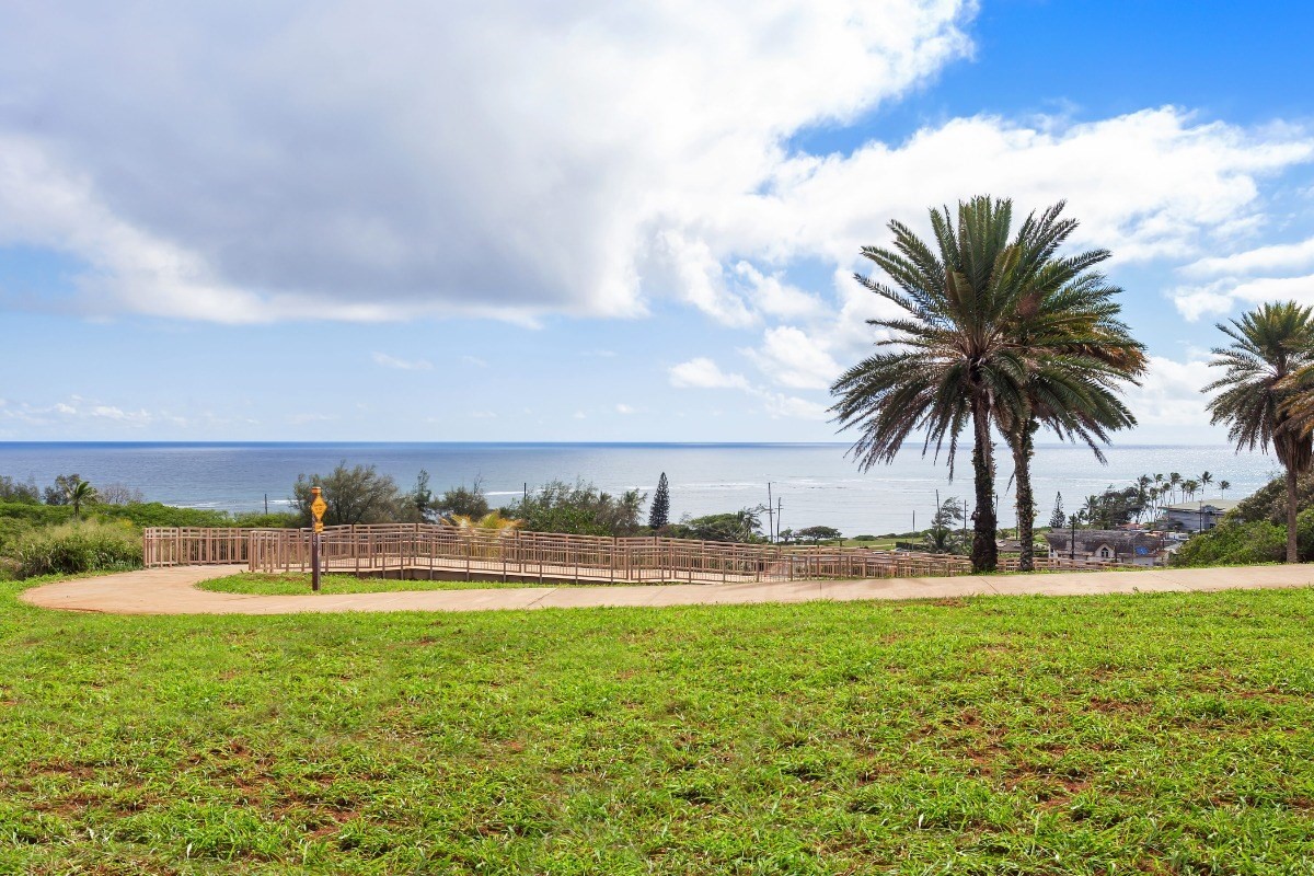 4701 Kawaihau Road, Unit L102 Kapaa, HI 96746 - Photo 22 of 22 a view of a lake with a big yard and large trees
