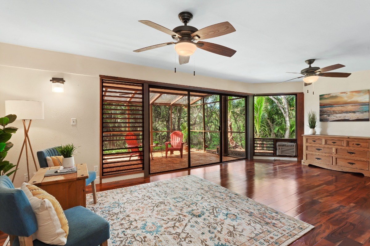 4701 Kawaihau Road, Unit L102 Kapaa, HI 96746 - Photo 3 of 22 a living room with furniture and a floor to ceiling window