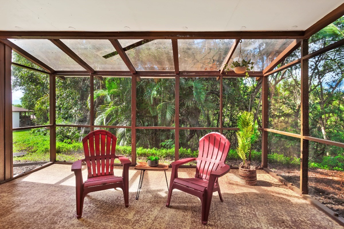 4701 Kawaihau Road, Unit L102 Kapaa, HI 96746 - Photo 4 of 22 a view of a two chairs in the deck