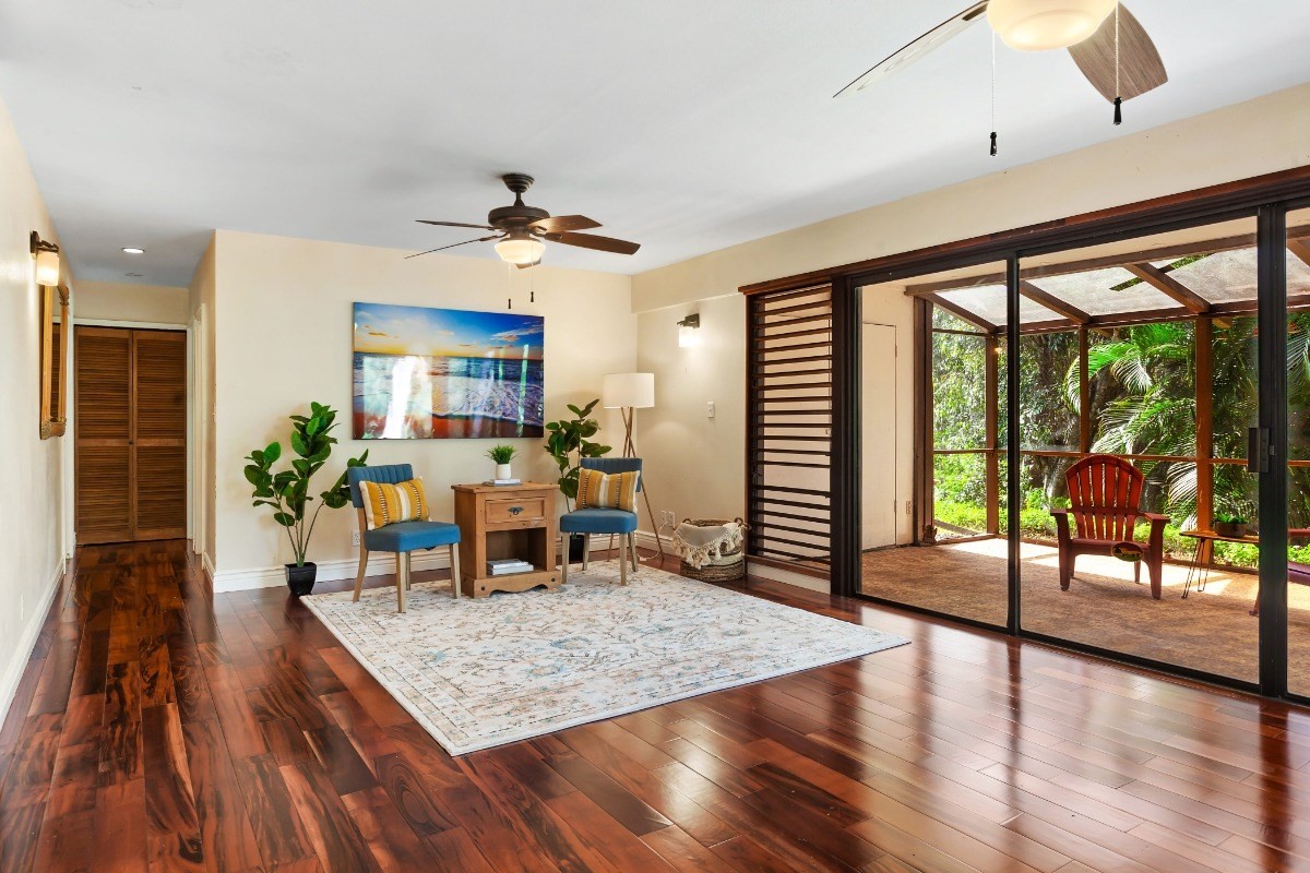 4701 Kawaihau Road, Unit L102 Kapaa, HI 96746 - Photo 10 of 22 a view of a dining room with furniture window and wooden floor