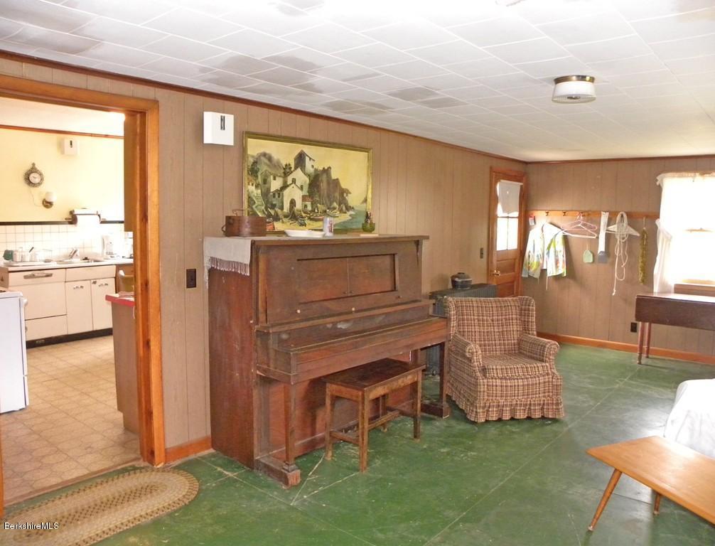 128 North Green River Road Colrain, MA 01340 - Photo 14 of 15 a living room with furniture and a dresser