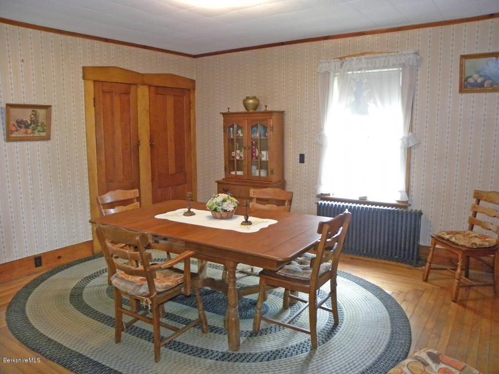 128 North Green River Road Colrain, MA 01340 - Photo 3 of 15 a view of a dining room with furniture and window