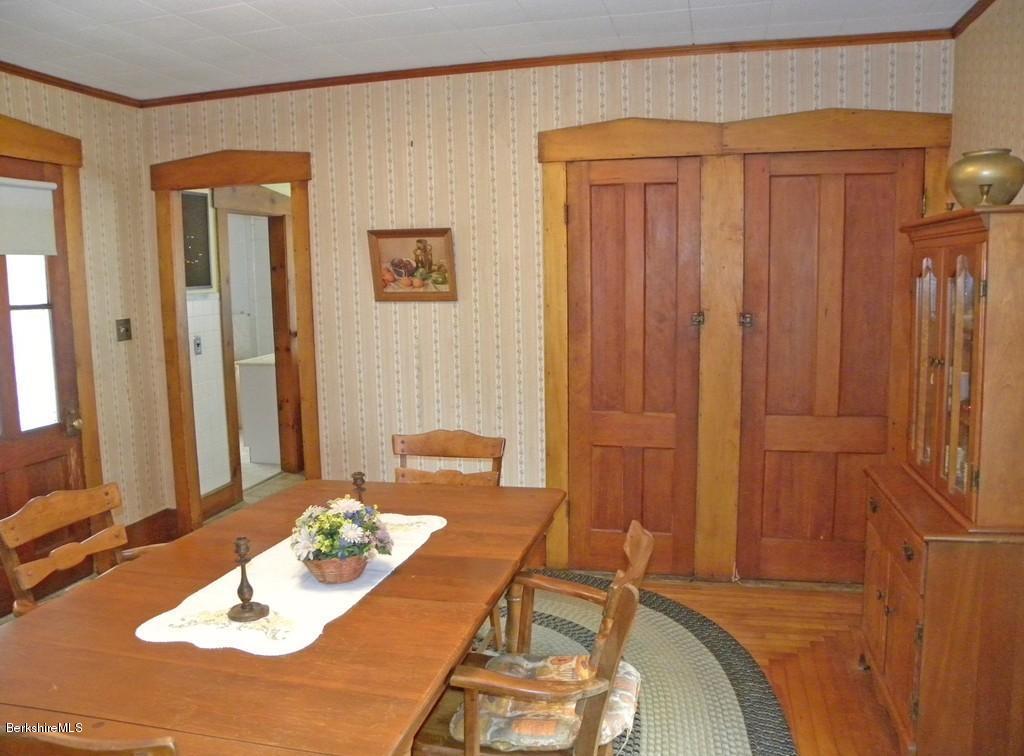 128 North Green River Road Colrain, MA 01340 - Photo 4 of 15 a room with a table and a chair