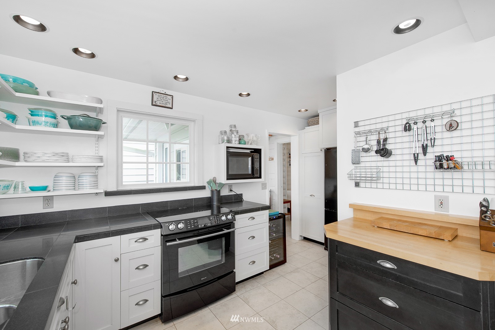 13201 Burma Road Southwest Vashon, WA 98070 - Photo 11 of 31 a kitchen that has a sink and a stove