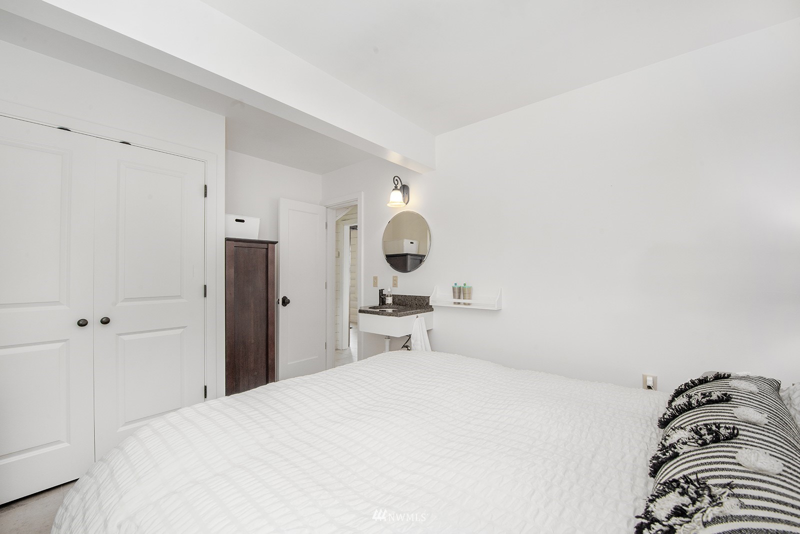 13201 Burma Road Southwest Vashon, WA 98070 - Photo 13 of 31 a bedroom with a bed and window