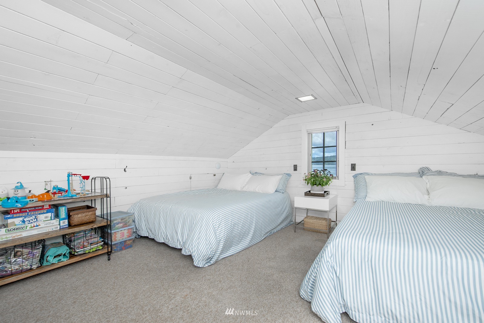 13201 Burma Road Southwest Vashon, WA 98070 - Photo 17 of 31 a bedroom with a bed and a window
