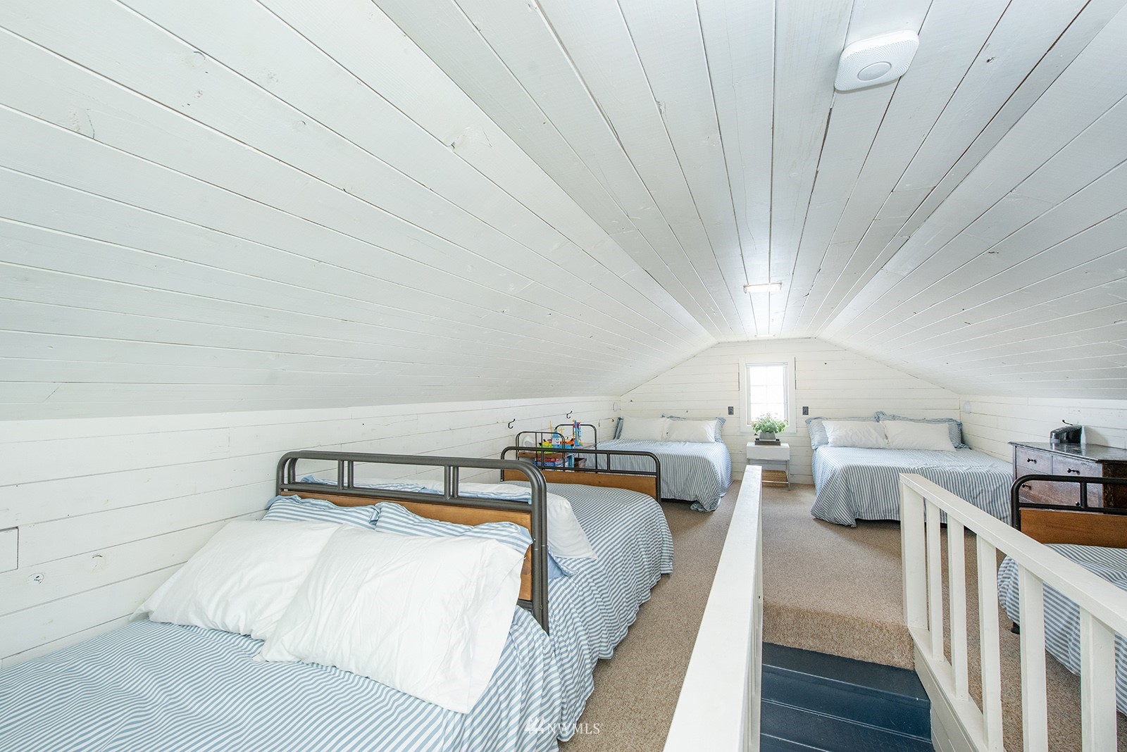 13201 Burma Road Southwest Vashon, WA 98070 - Photo 18 of 31 a bedroom with furniture and a wooden floor