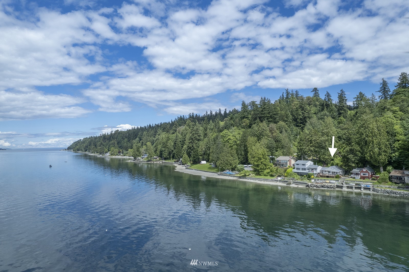 13201 Burma Road Southwest Vashon, WA 98070 - Photo 2 of 31 a view of a lake with houses in the back