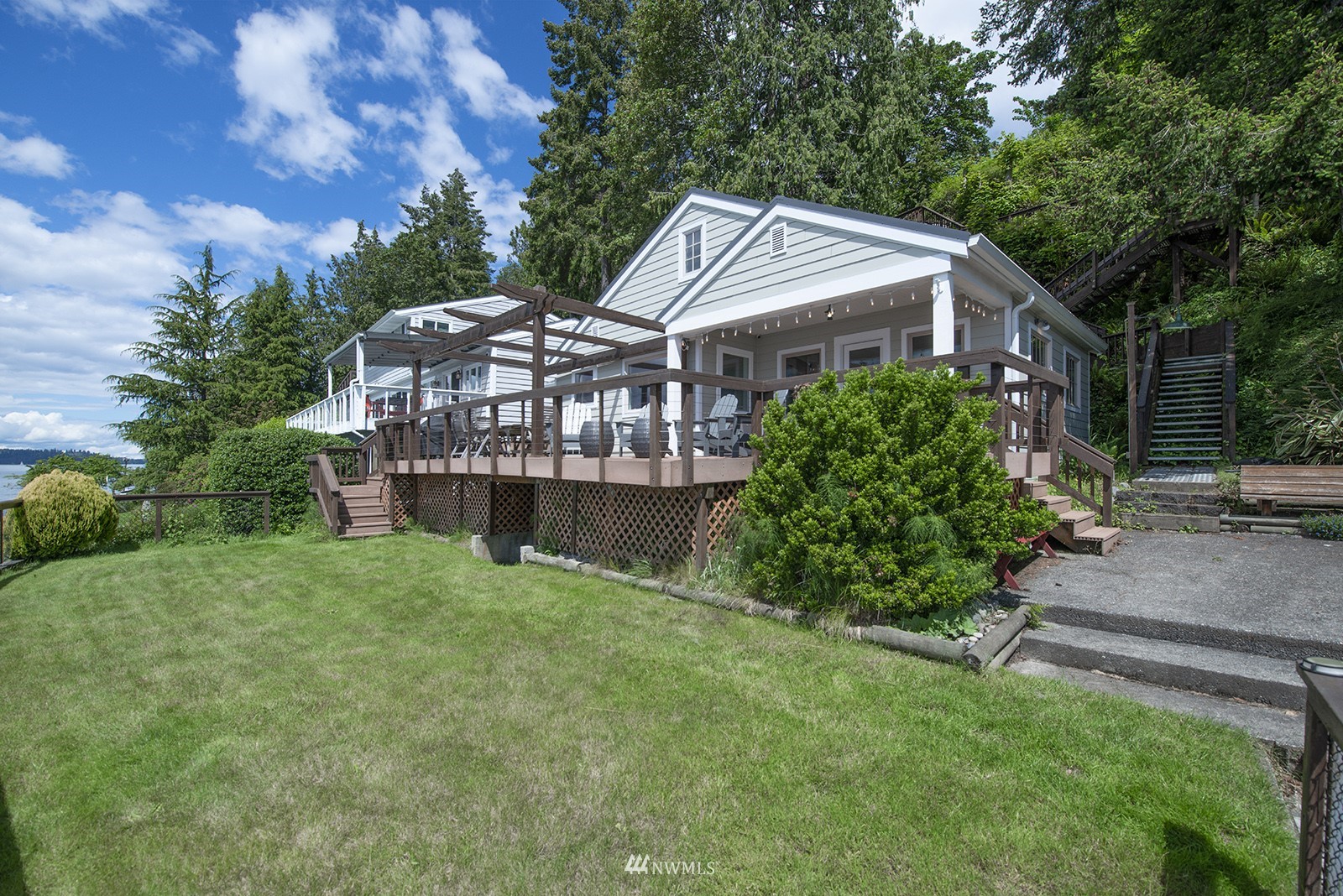 13201 Burma Road Southwest Vashon, WA 98070 - Photo 27 of 31 a view of a big house with a big yard plants and large trees