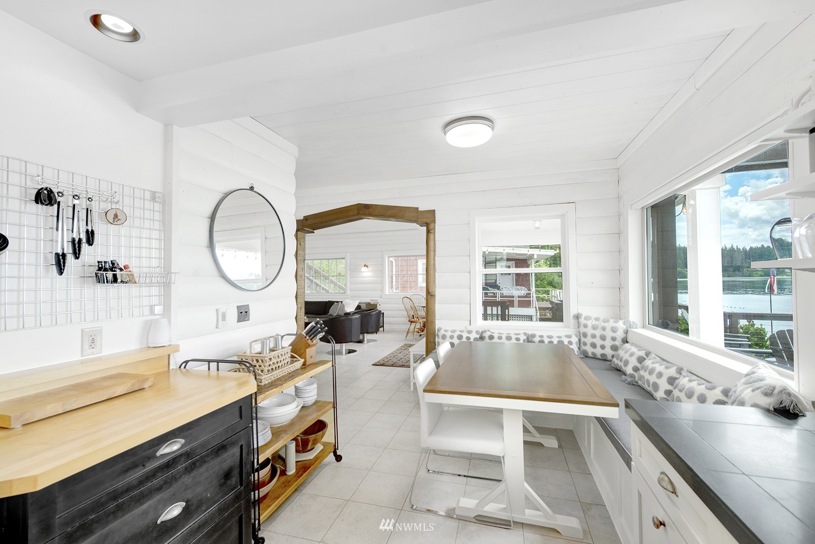 13201 Burma Road Southwest Vashon, WA 98070 - Photo 7 of 31 a large kitchen with a large window and a view of living room