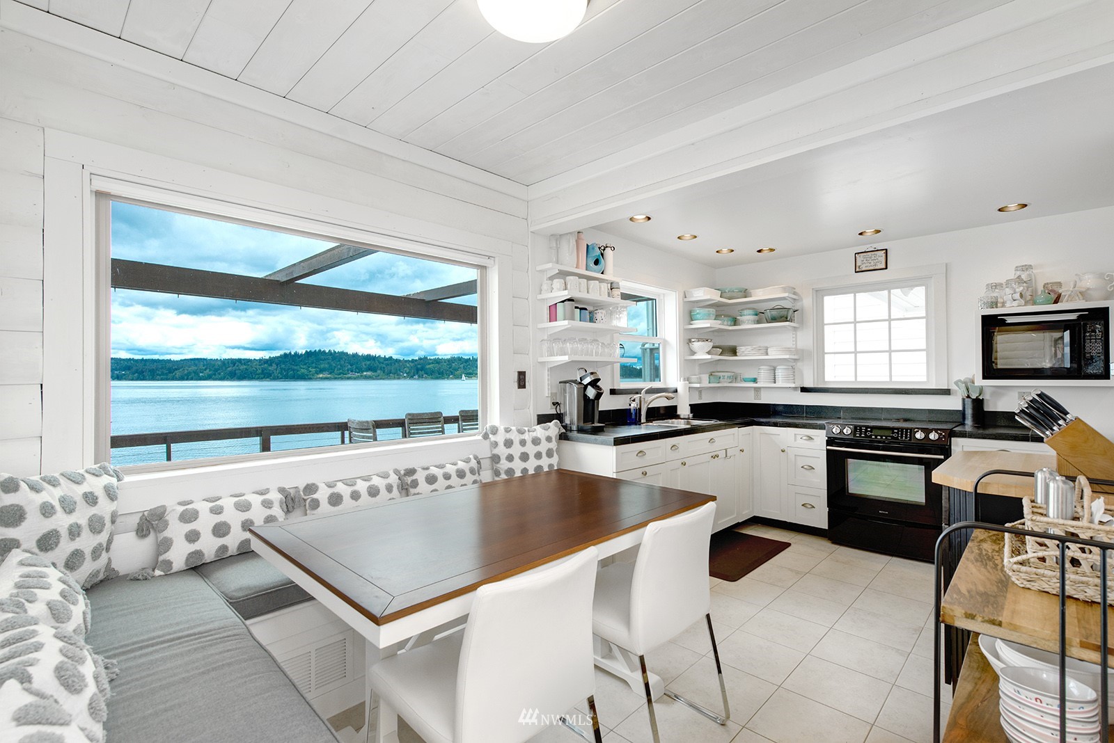13201 Burma Road Southwest Vashon, WA 98070 - Photo 9 of 31 a kitchen with a sink and a stove top oven