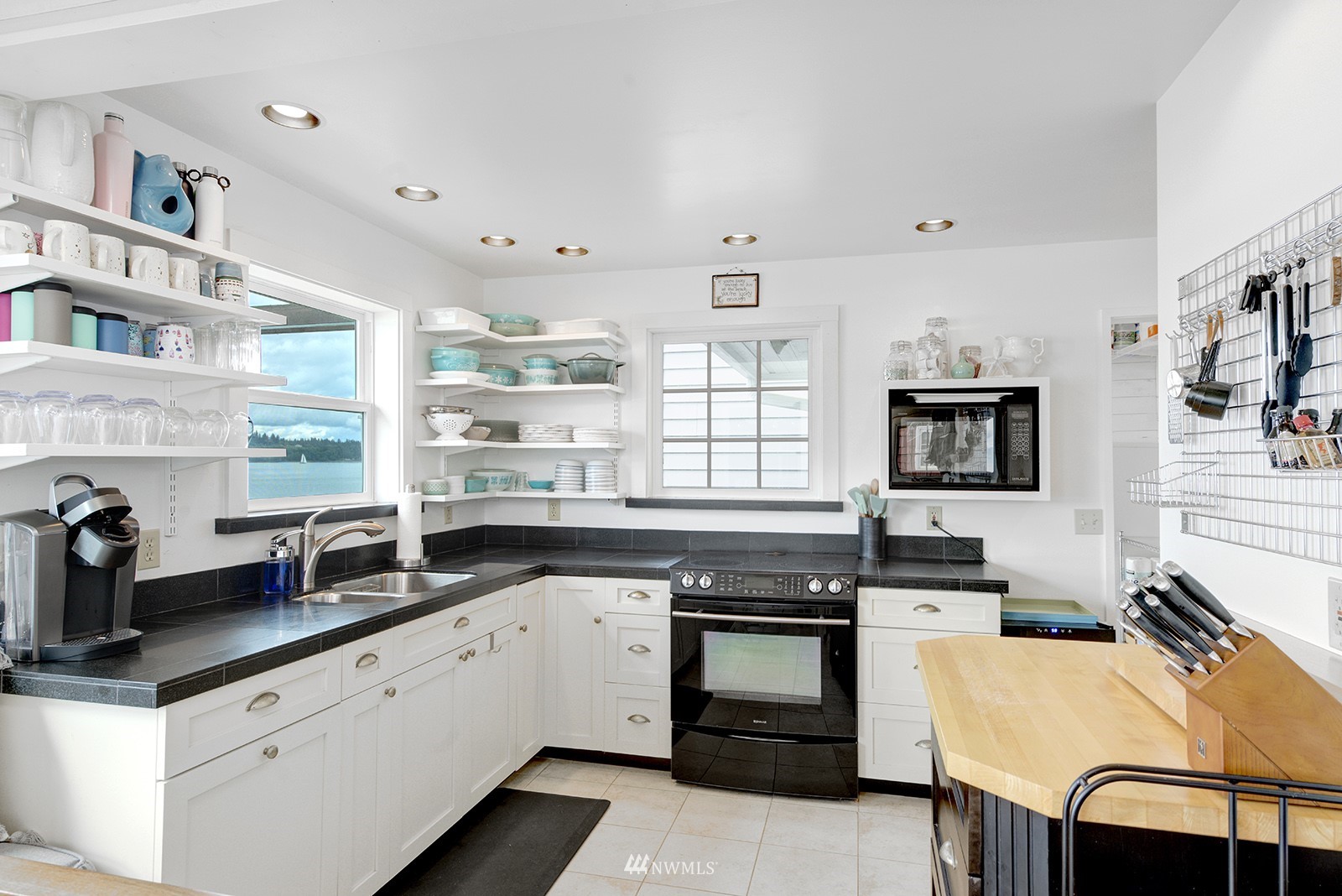 13201 Burma Road Southwest Vashon, WA 98070 - Photo 10 of 31 a kitchen with stainless steel appliances granite countertop a sink stove and refrigerator