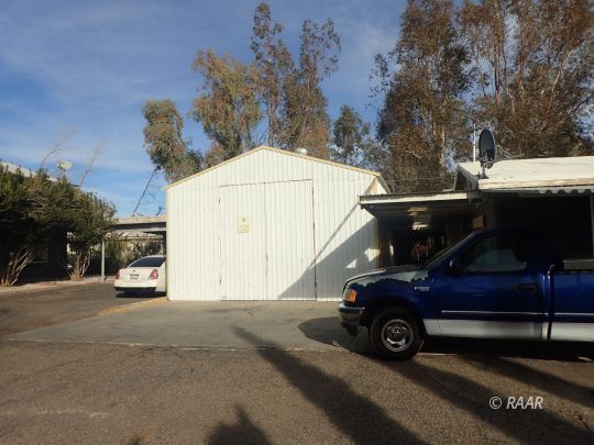 323 South Norma Street Ridgecrest, CA 93555 - Photo 3 of 7 a car parked in front of a house