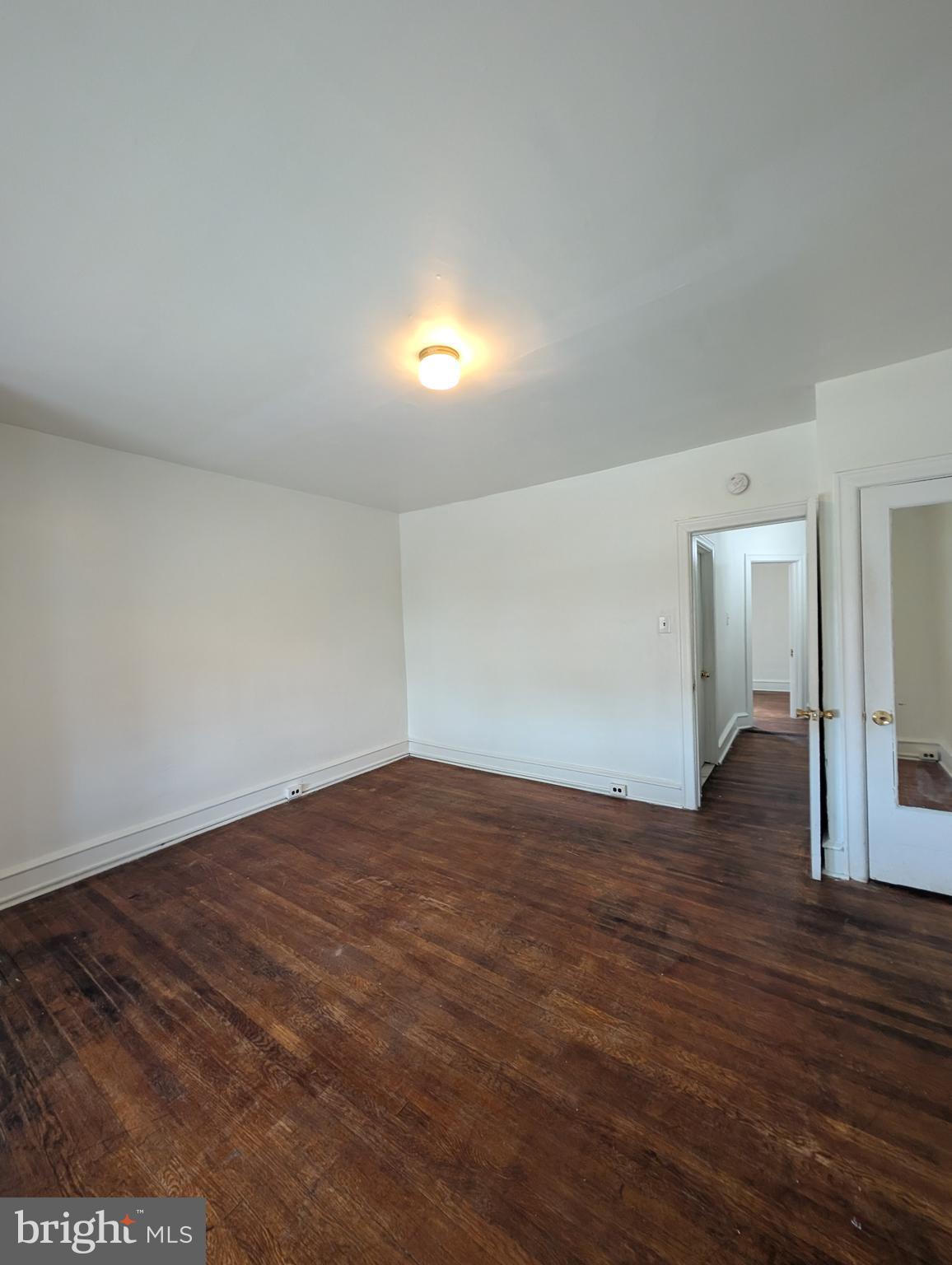 5927 Springfield Avenue Philadelphia, PA 19143 - Photo 13 of 17 a view of empty room with wooden floor