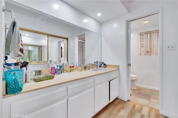 a bathroom with a double vanity sink and a mirror